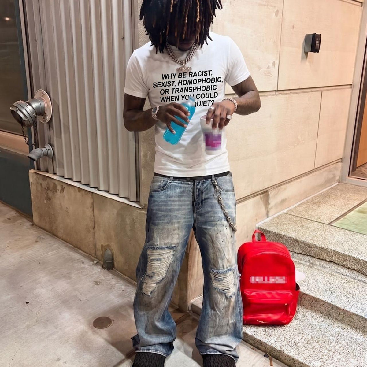 a young model wearing an Erisce Cire slogan tee